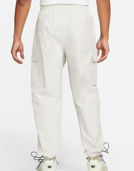 Jasnoszare Spodnie Męskie Nike Sportswear Repeat DX2033-072 r. XS